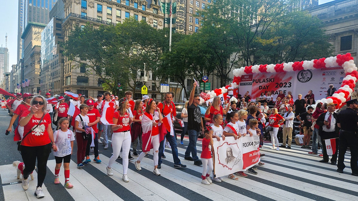 People march in attendance at the Pulaski Day Parade in New York City