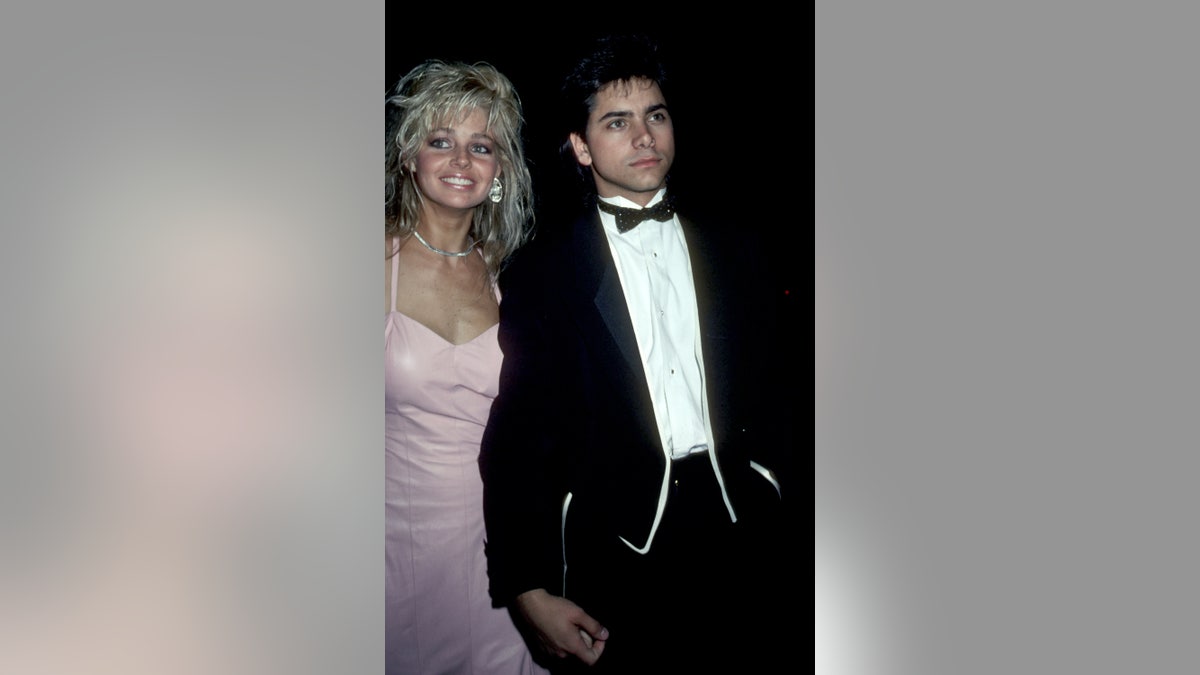 John Stamos and Teri Copley smiling