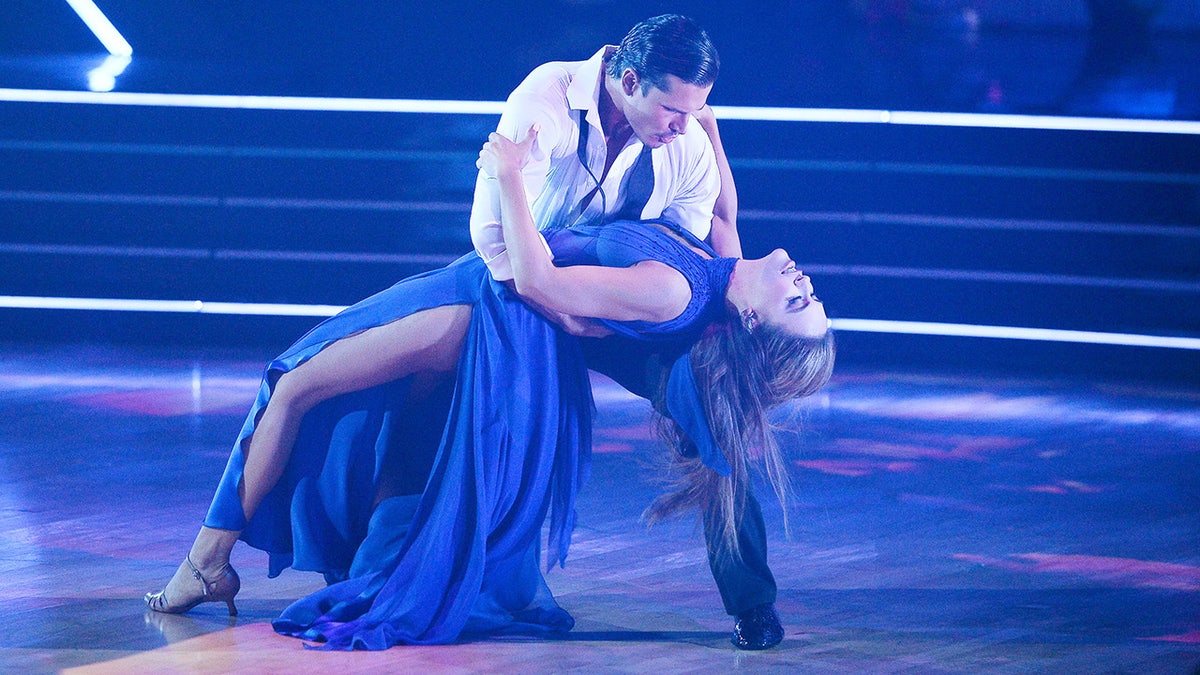 Gleb Savchenko and Jana Kramer dancing