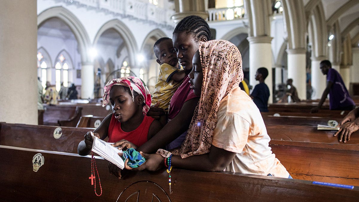 family praying the Rosary