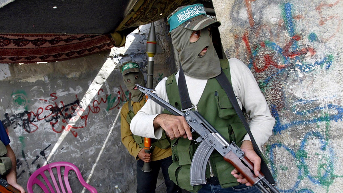 Hamas fighters with various weapons