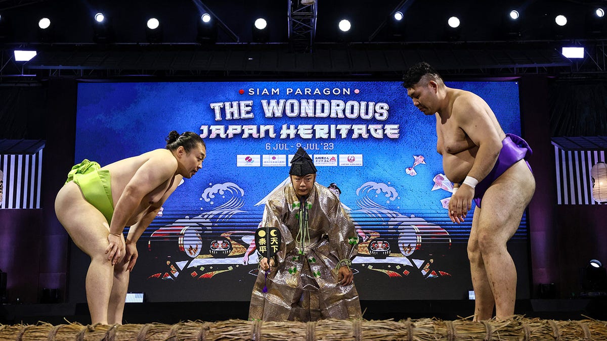 two sumo wrestlers face off