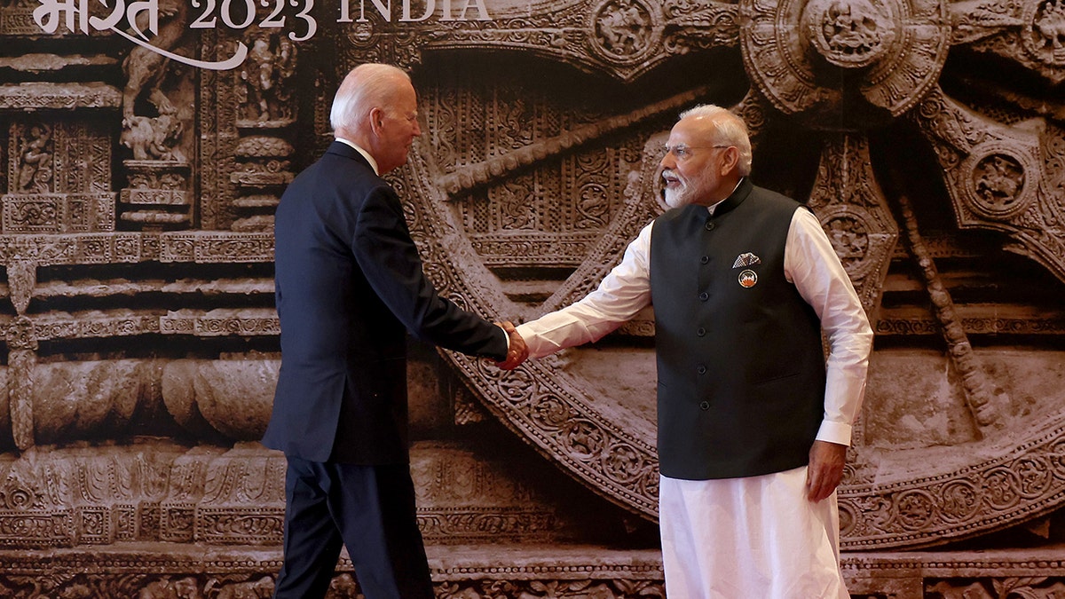Biden, Modi shaking hands