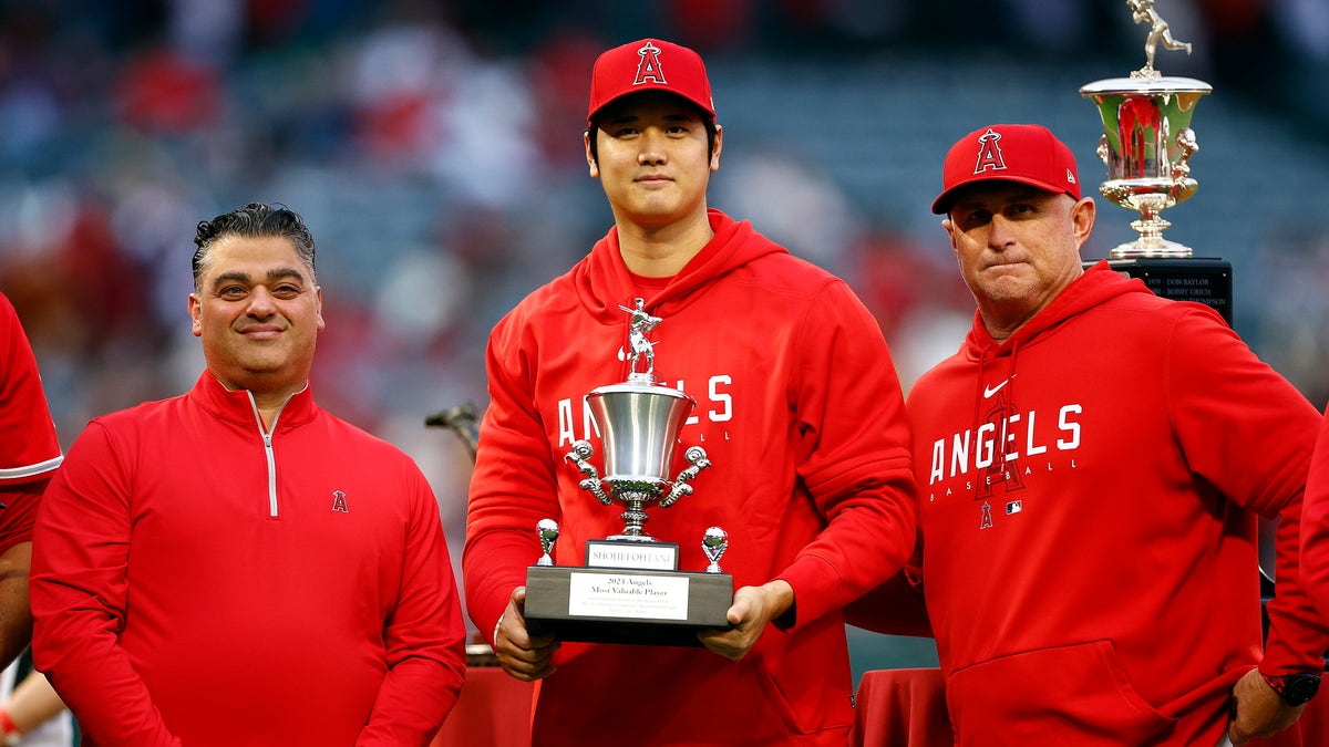 Shohei Ohtani receives an award from the Los Angeles Angels