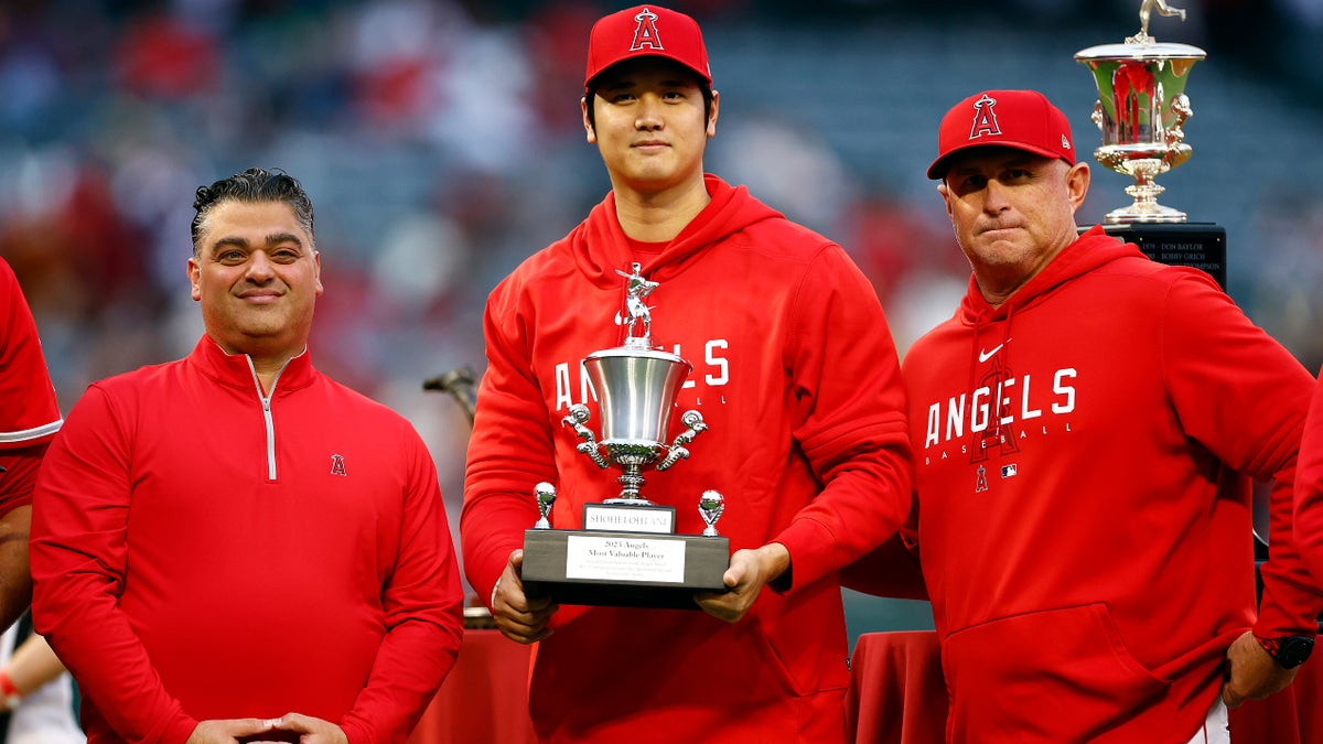 Shohei Ohtani receives an award from the Los Angeles Angels