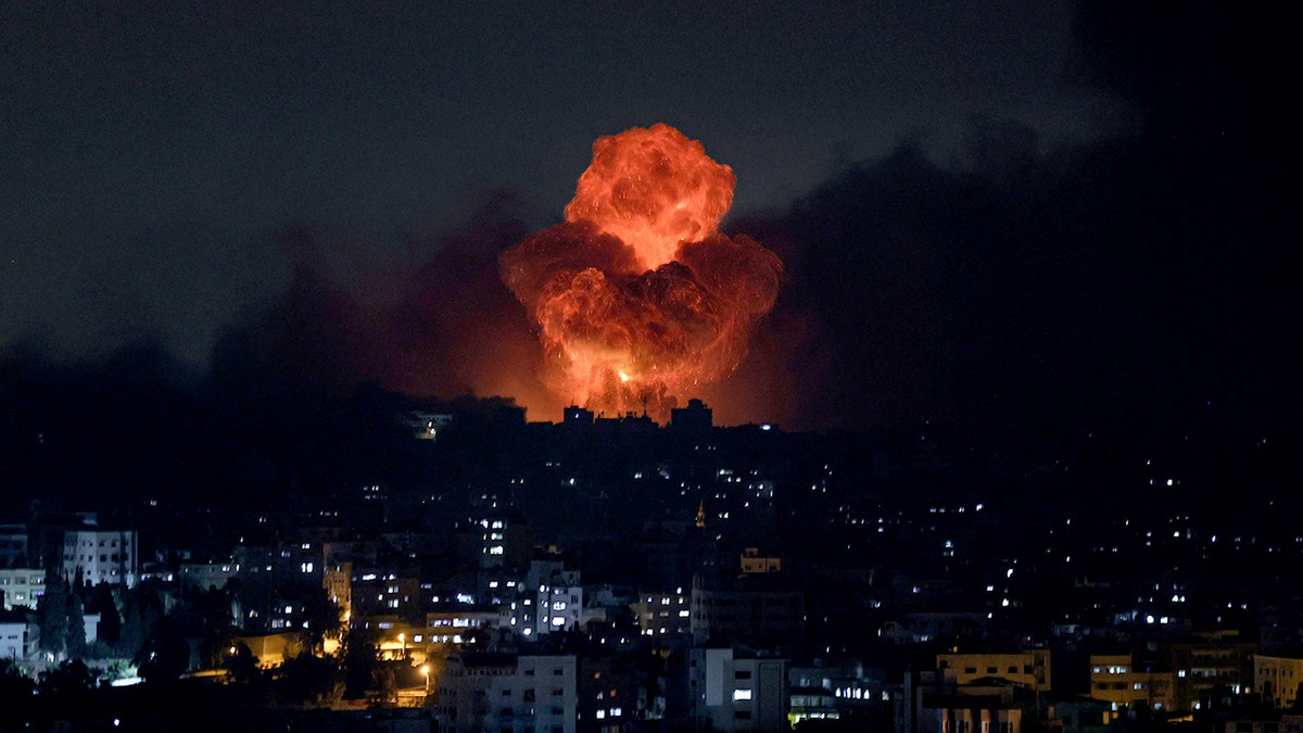 Flames and smoke rise from a nighttime Israeli attack on Gaza after Hamas launched a massive terrorist attack