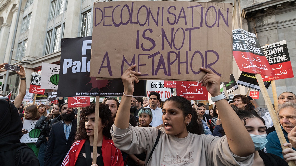 Palestinians and their supporters gather outside the Embassy of Israel in London on October 09, 2023. 