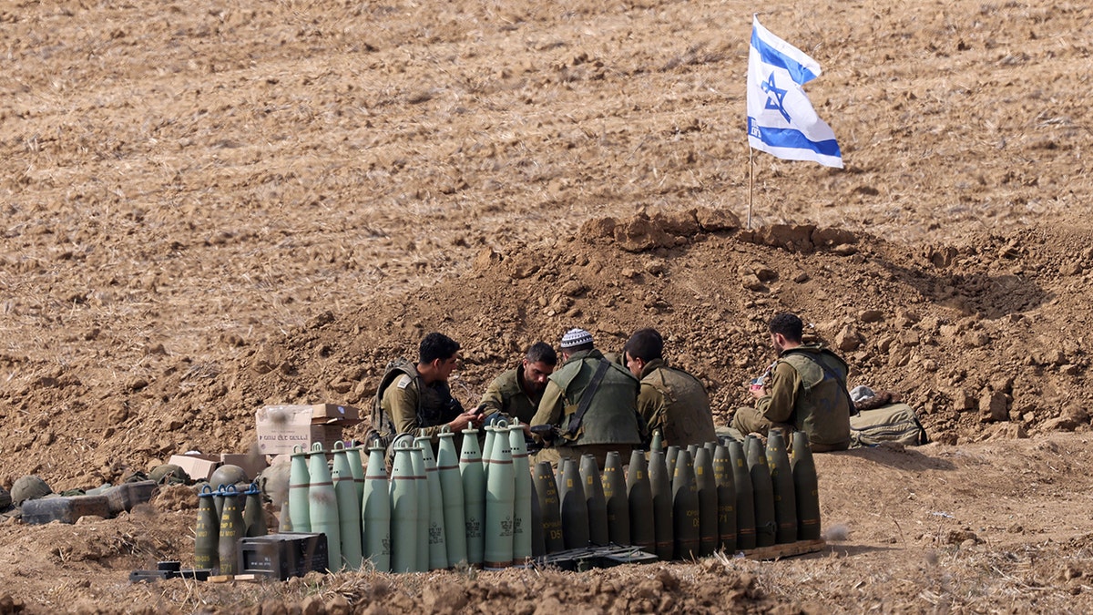 Israeli soldiers near munitions near the border with Gaza