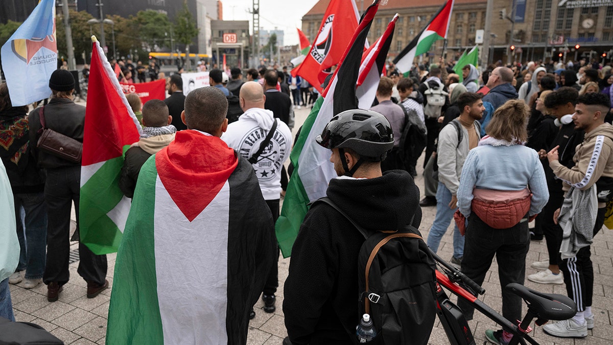 Demonstrators carry Palestinian flags in Leipzig, Germany, on Oct. 12, 2023.