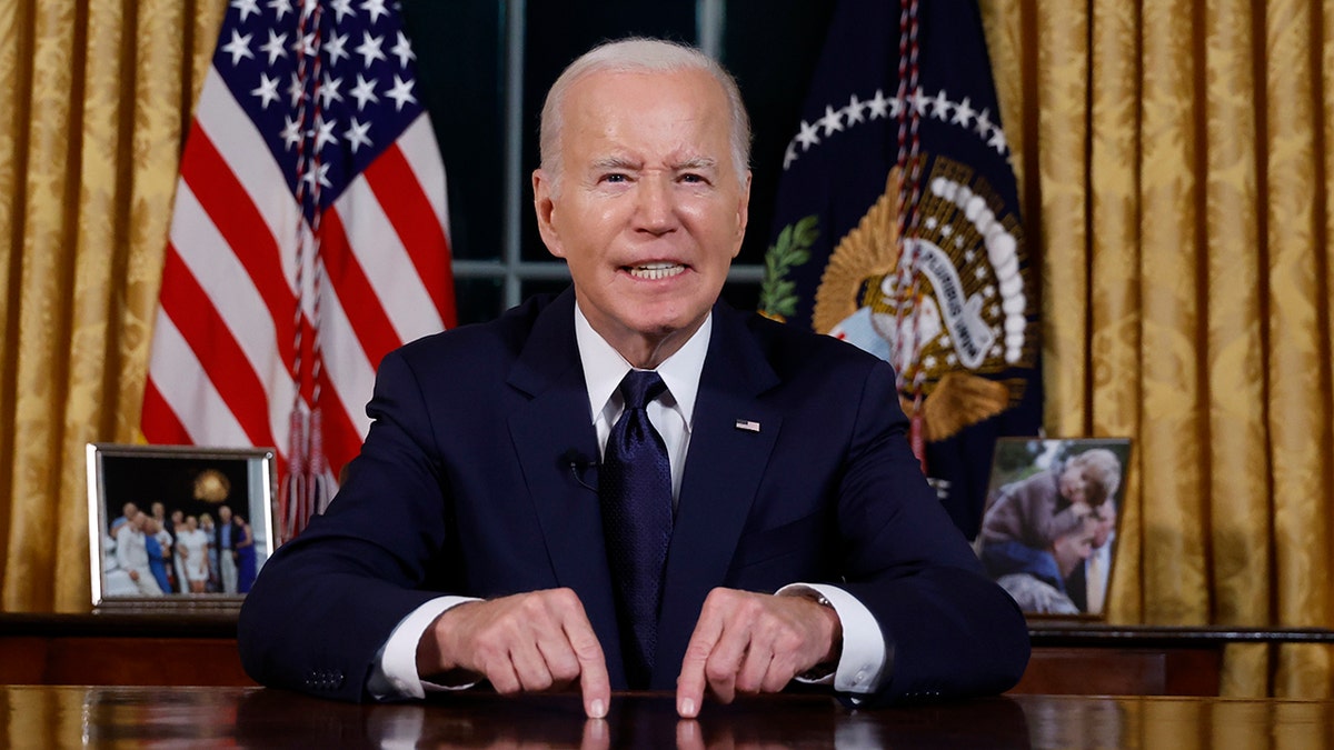 Biden giving address at his desk in oval office 