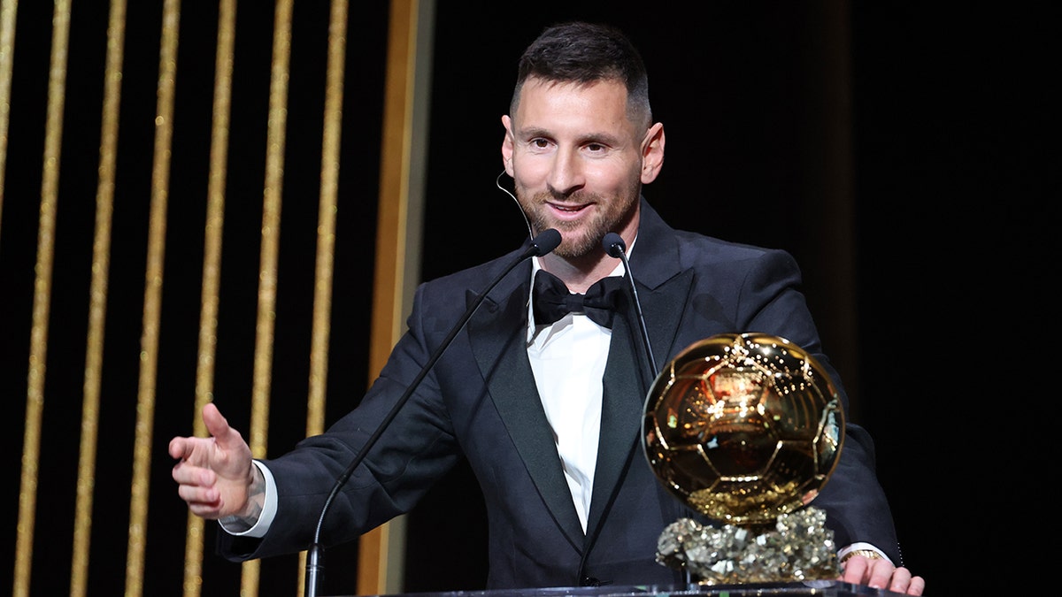 Lionel Messi with the Ballon D'Or