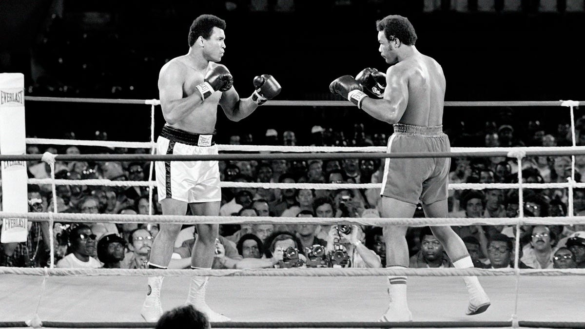 Muhammad Ali and George Foreman fighting