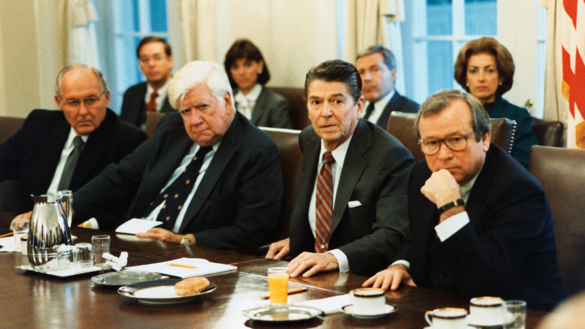 (Original Caption) President Reagan meets with members of Congress at 8:15 a.m. this morning in the Cabinet Room regarding the Grenada situation. From left are: Congressman Bob Michel, Speaker Tip O'Neill, the President and Senator Howard Baker.