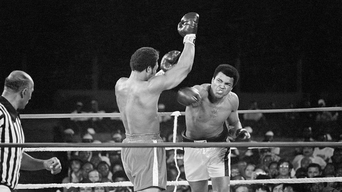 George Foreman and Muhammad Ali mid-fight