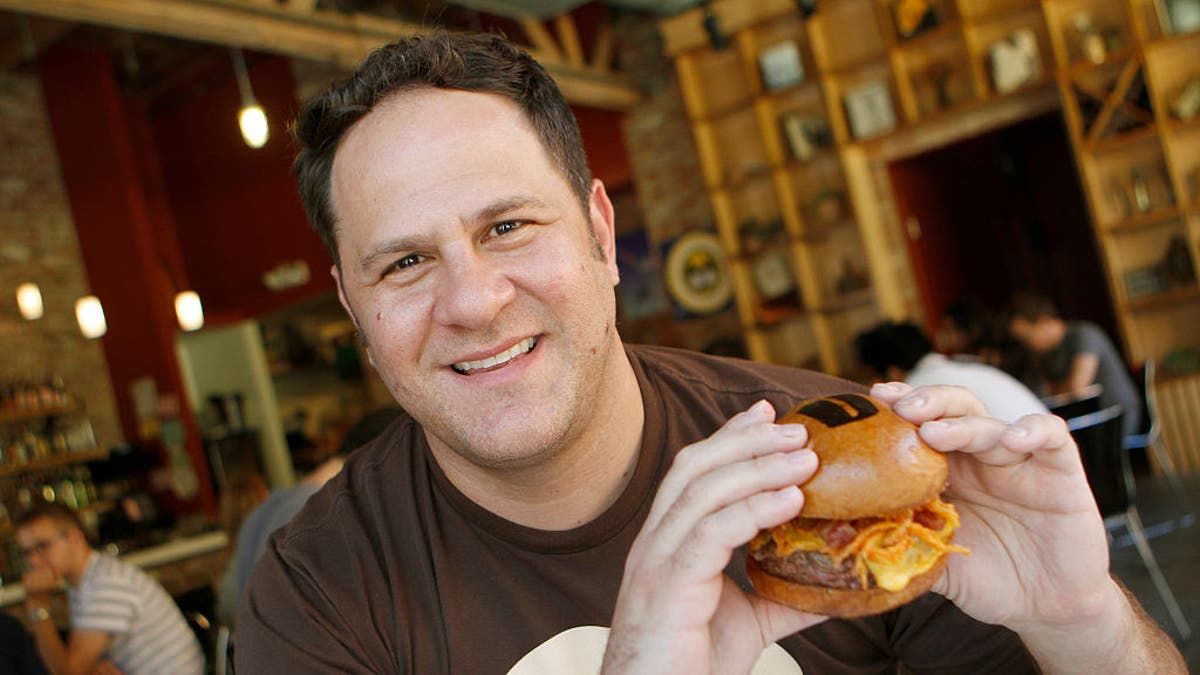 Adam Fleischman with burger