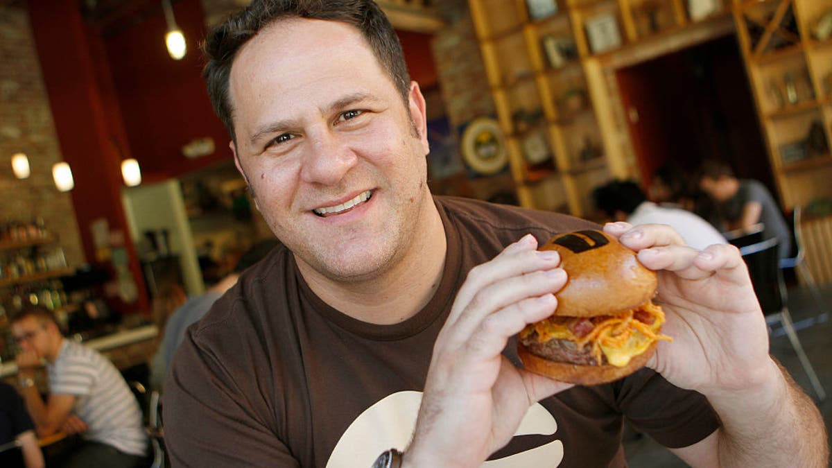 Adam Fleischman with burger