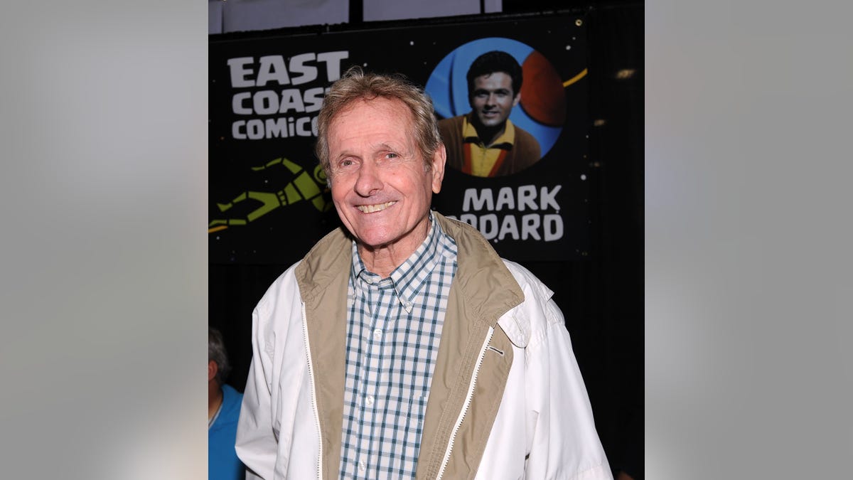 Mark Goddard smiling at his comic con booth