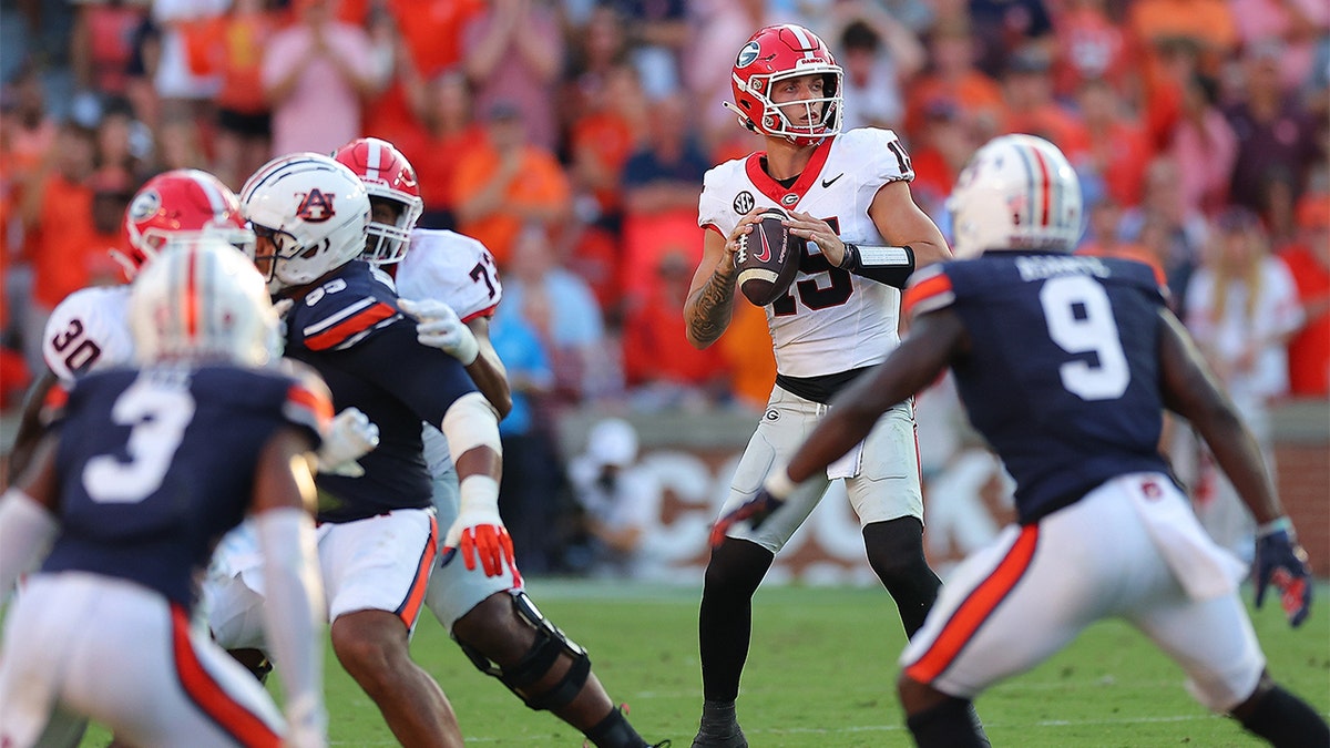 Carson Beck plays against Auburn