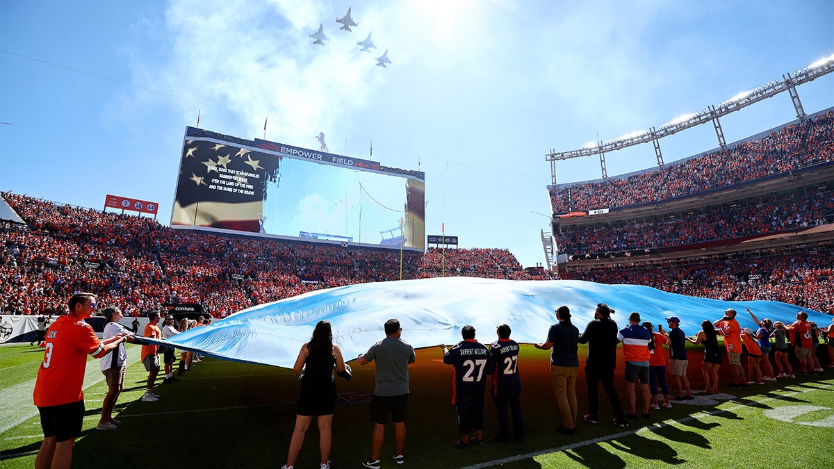 Jets fly over Empower Field