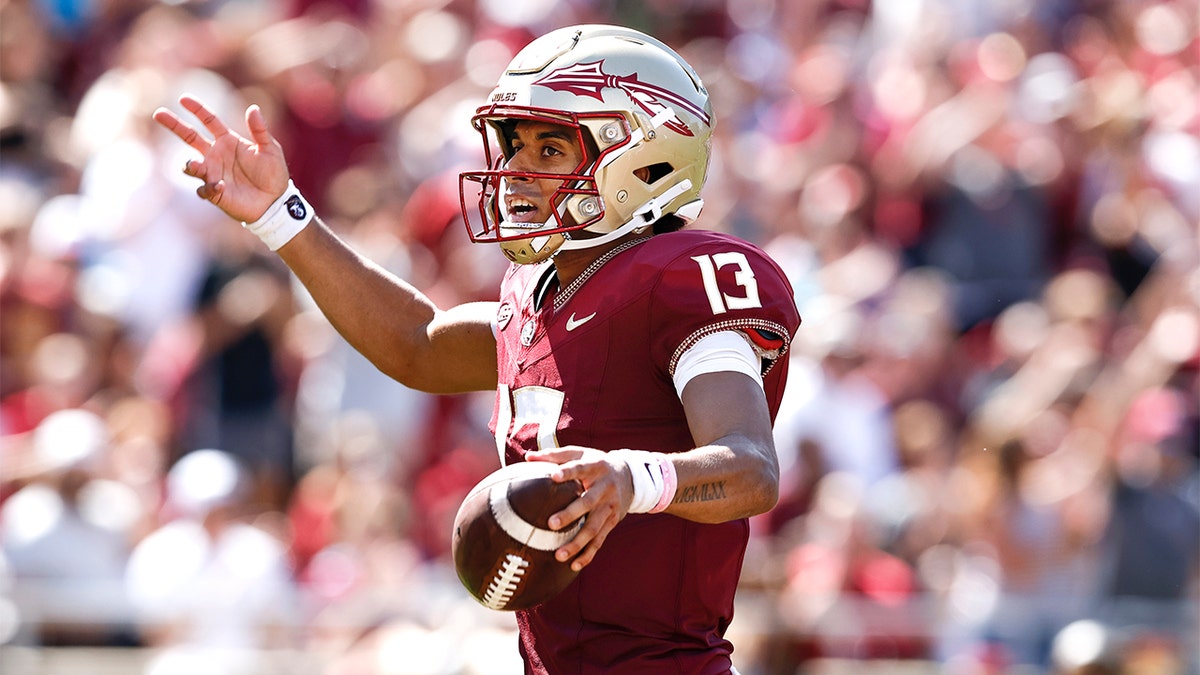 Quarterback Jordan Travis celebrates a touchdown