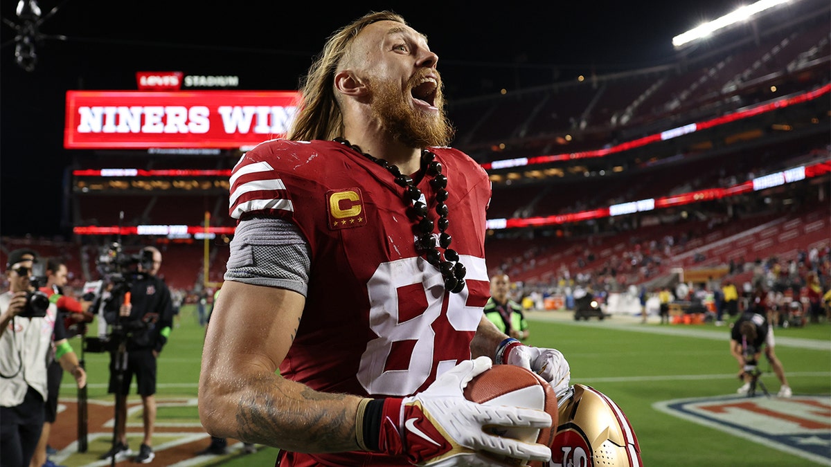 George Kittle reacts after beating Dallas