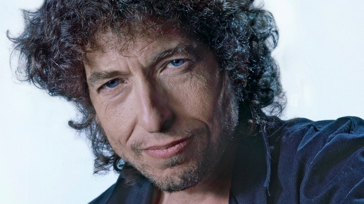 A close-up of Bob Dylan looking directly at the camera