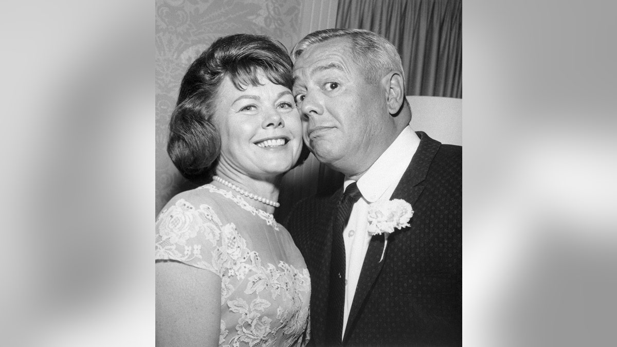 Desi Arnaz leaning against his second wife