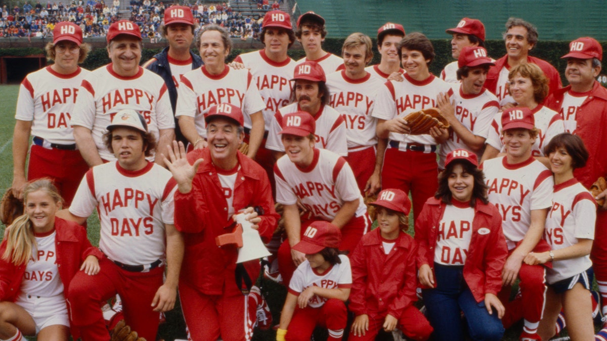 The cast of "Happy Days" in softball gear