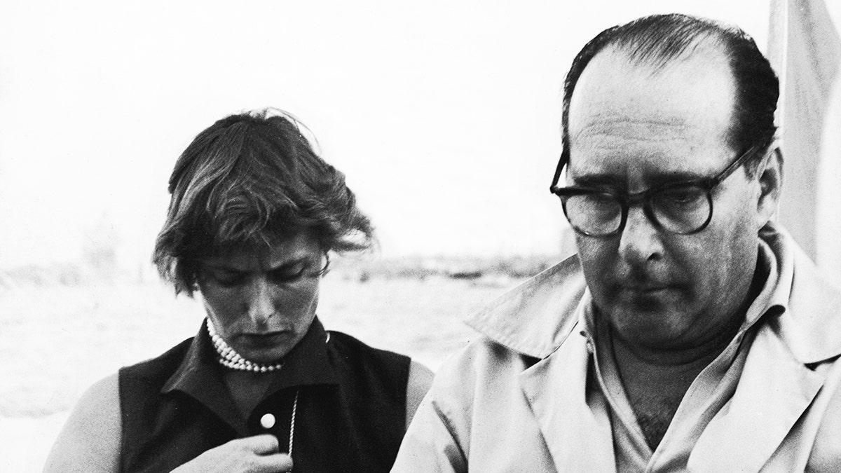 Ingrid Bergman and her second husband Roberto Rossellini, looking downcast