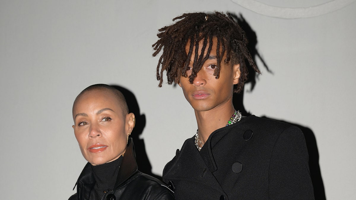 A close-up of Jada Pinkett Smith and her son Jaden Smith wearing black