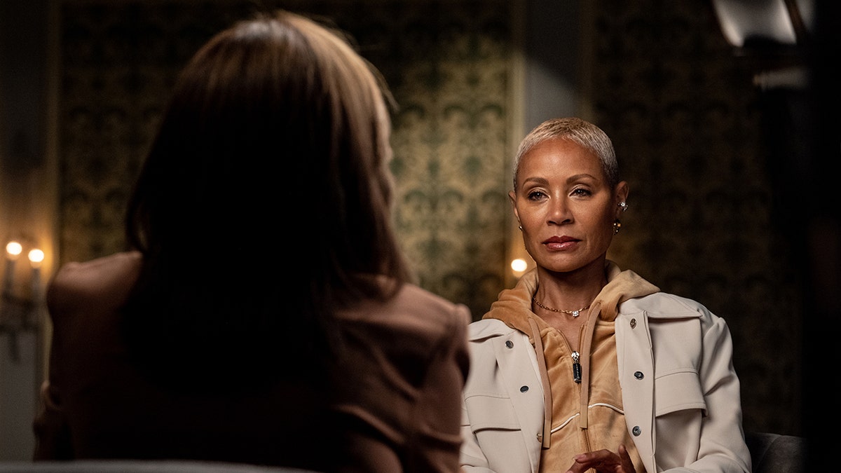 Jada Pinkett Smith looking serious as she is interviewed by Hoda Kotb