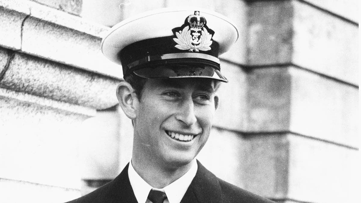A close-up of a young Prince Charles in his naval uniform