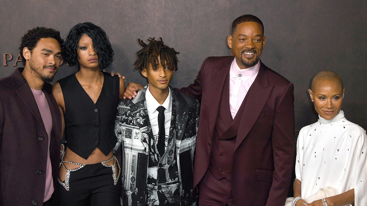 Jada Pinkett Smith and Will Smith smiling with their children