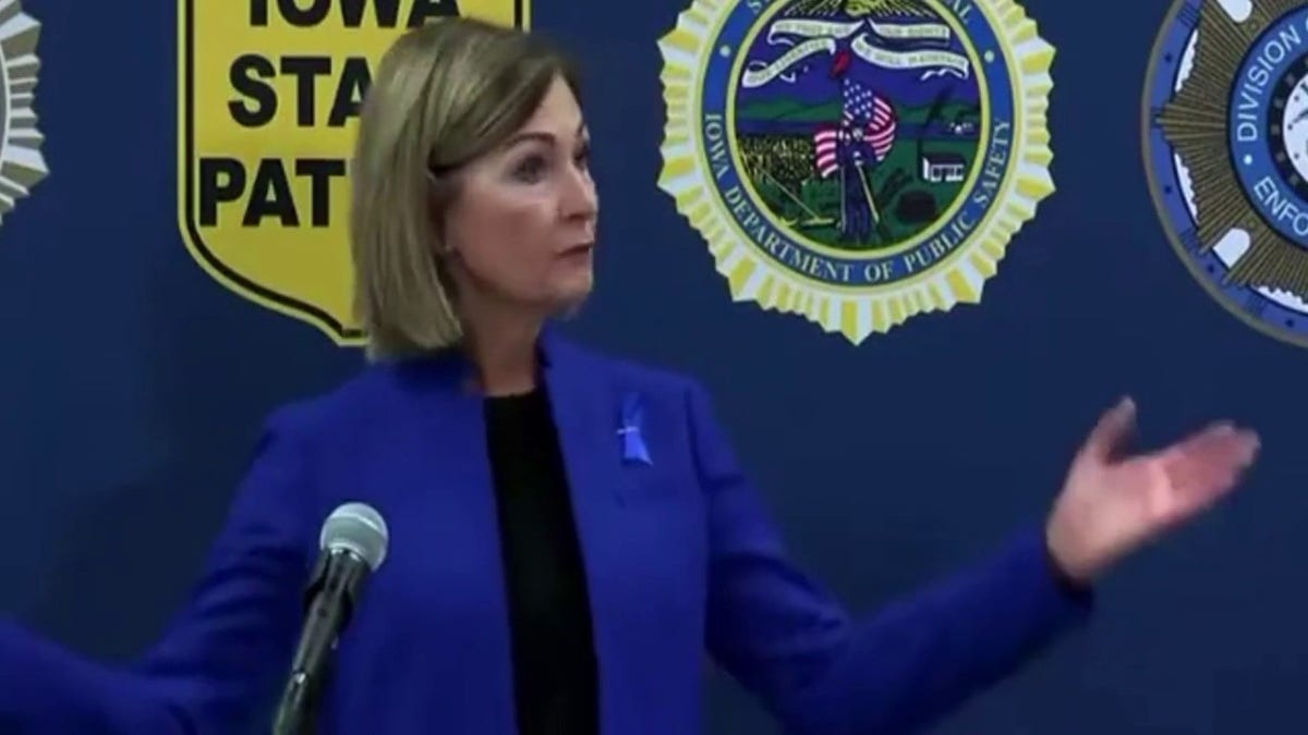 Gov. Kim Reynolds at a conference