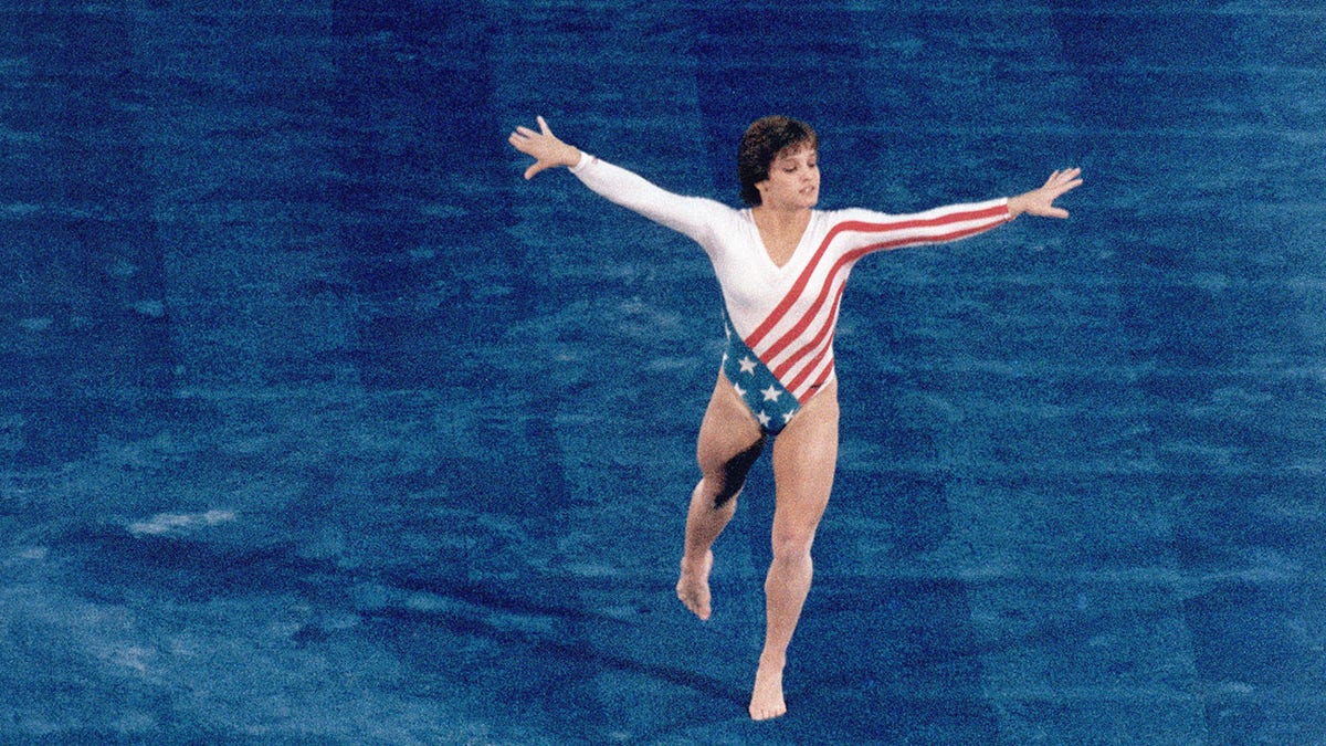 Mary Lou Retton competes in a gymnastics event