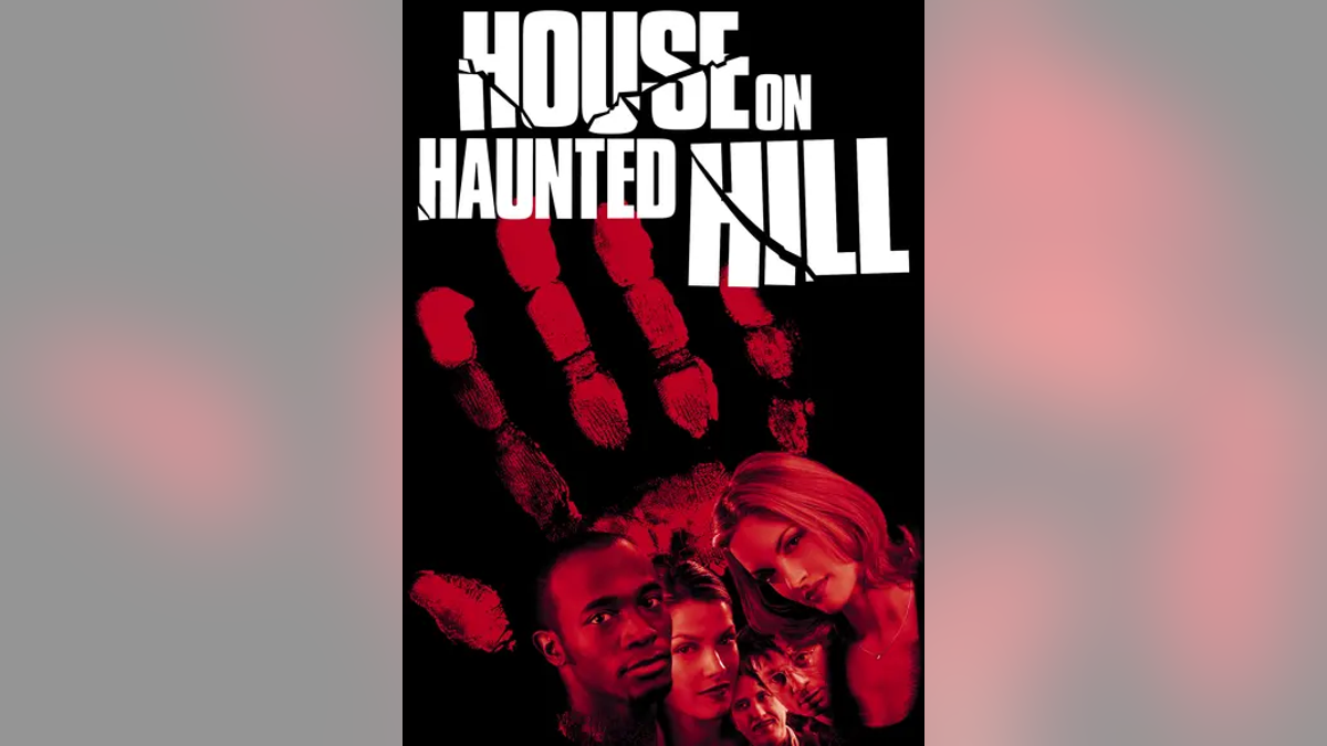 Movie poster of "House on Haunted Hill" with red palm and people's faces