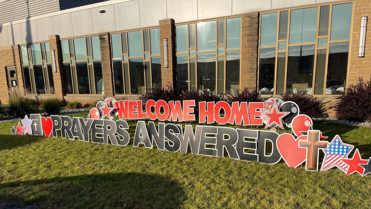 Welcome home sign at Holy Cross Church
