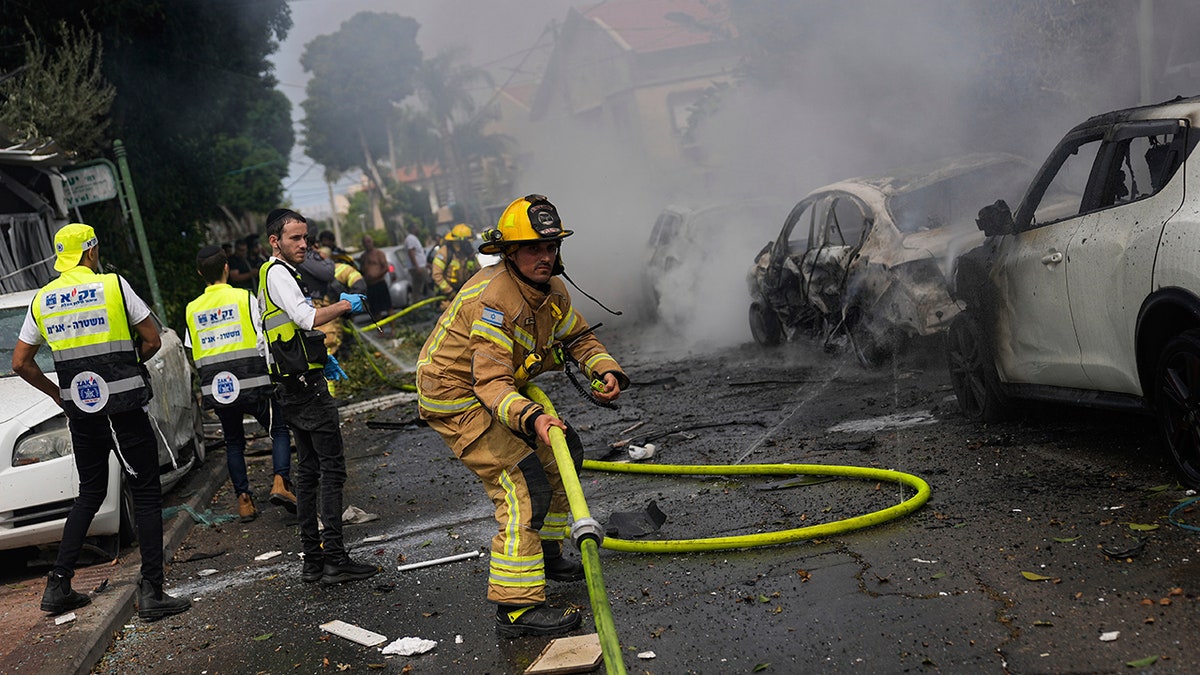 firefighters on scene of rocket strike in Israel