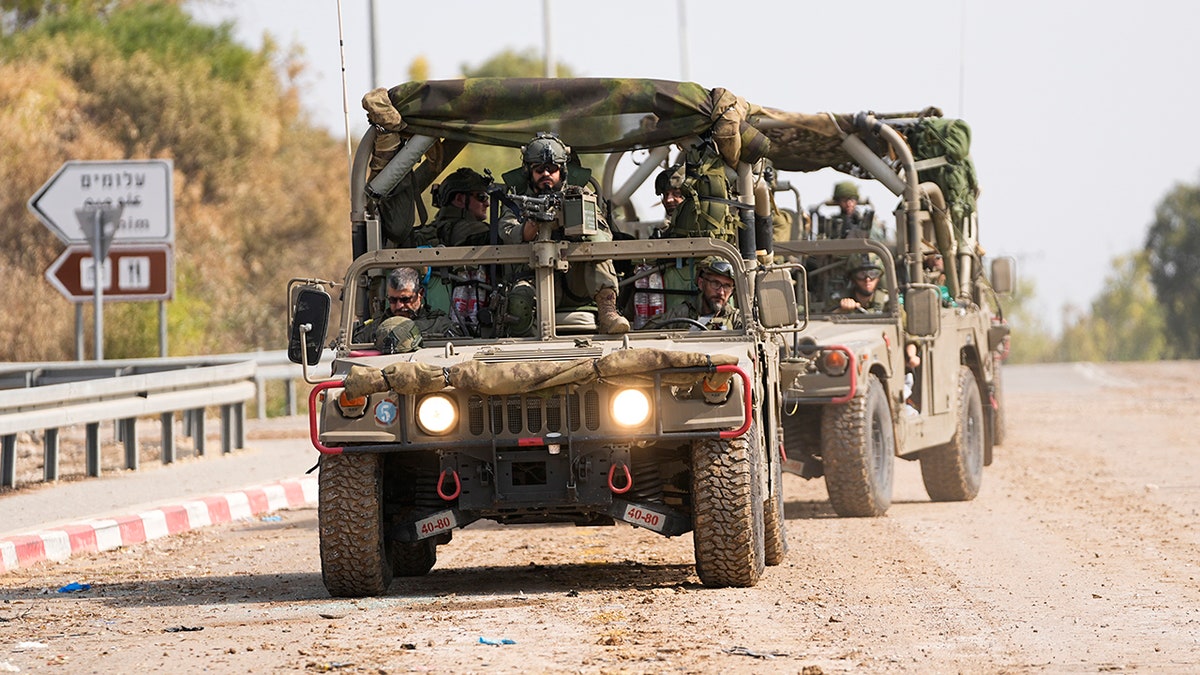 Israeli military near the Gaza Strip border fence