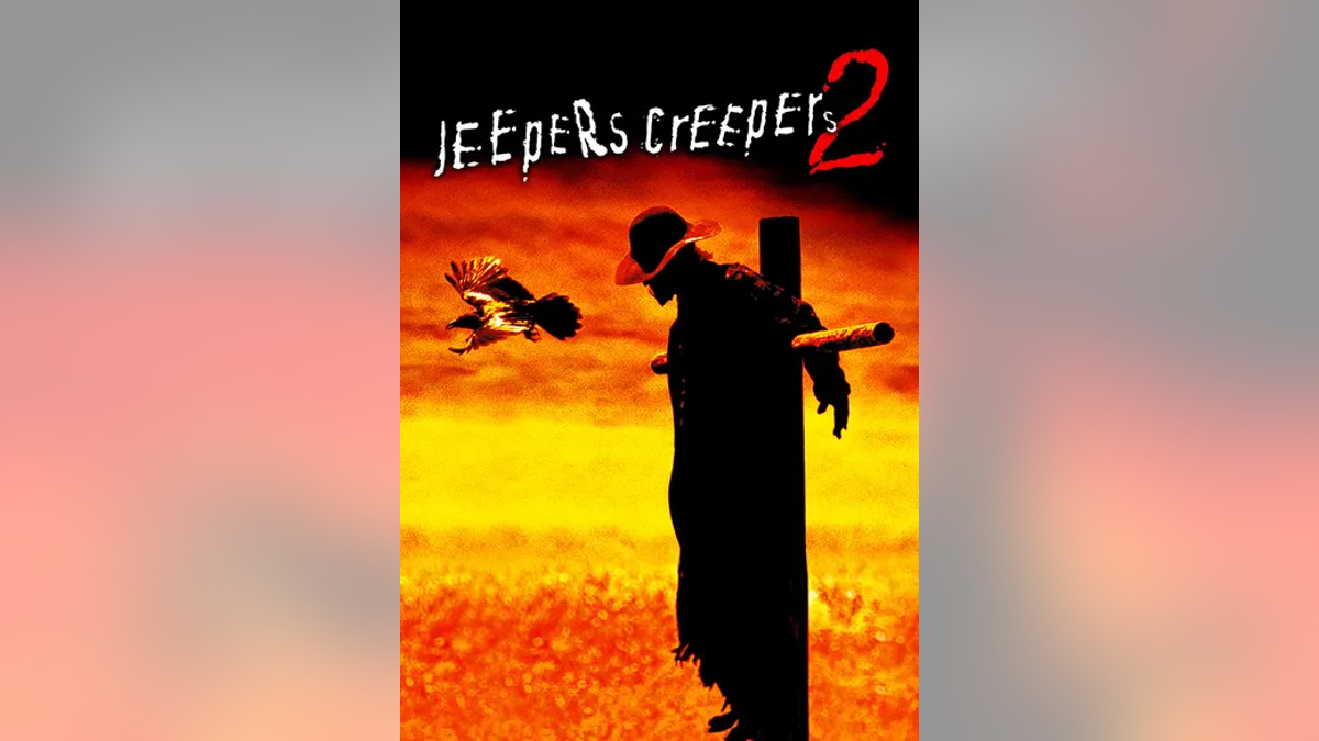 Man on cross with title of movie, "Jeepers Creepers"