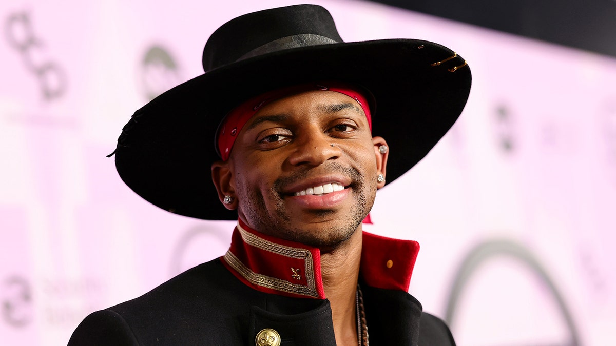 Jimmie Allen wearing a hat