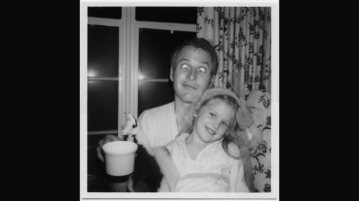 Paul Newman making a funny face with his daughter Melissa