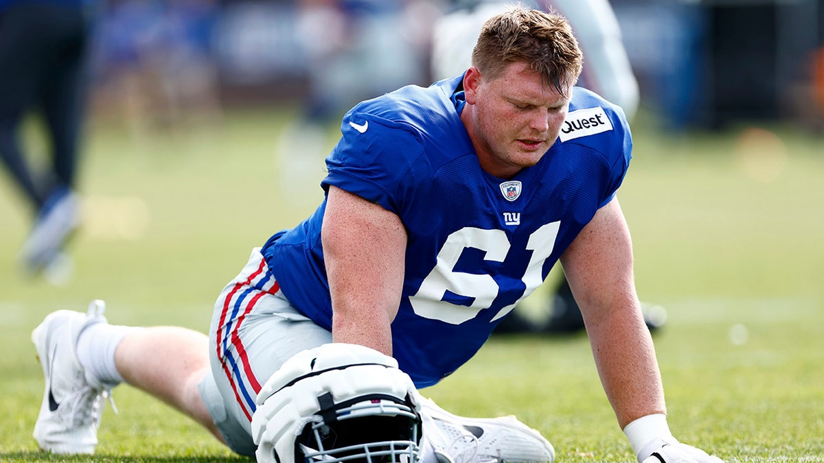 John Michael Schmitz stretches