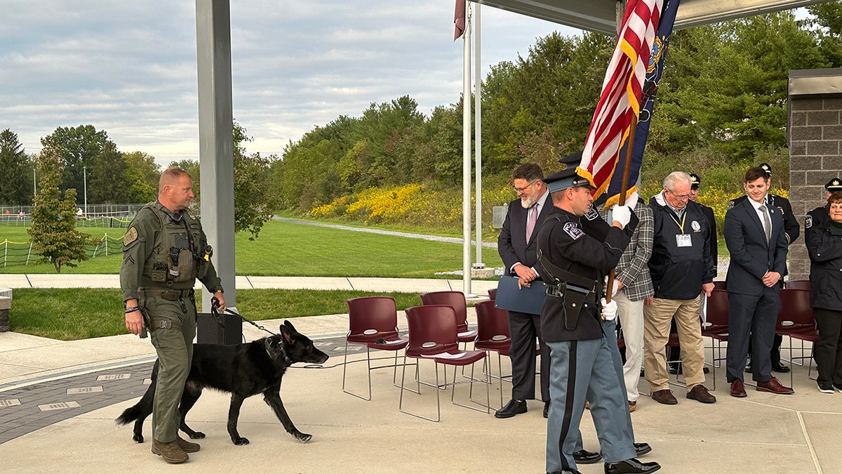 K9 dog retiring walking down aisle