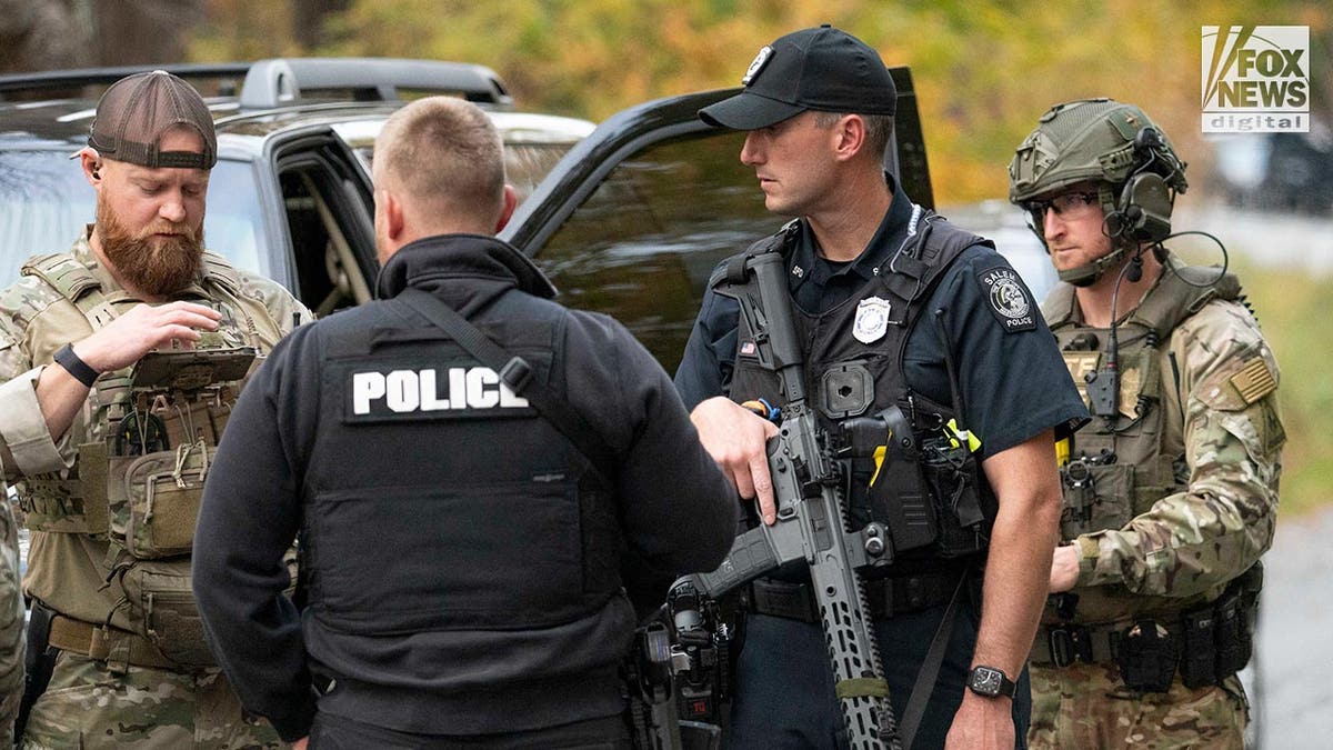 Police outside a home where Robert Cardis known to lived before the Lewiston mass shooting