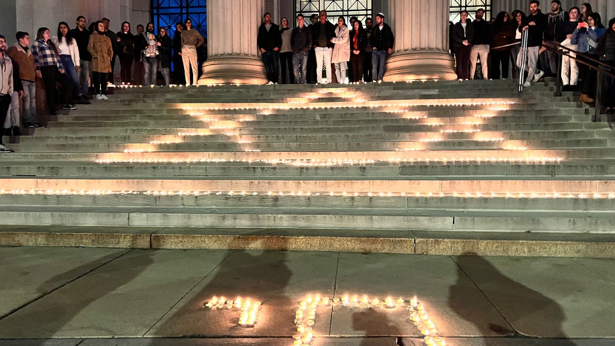 Candles form the Star of David on steps at MIT