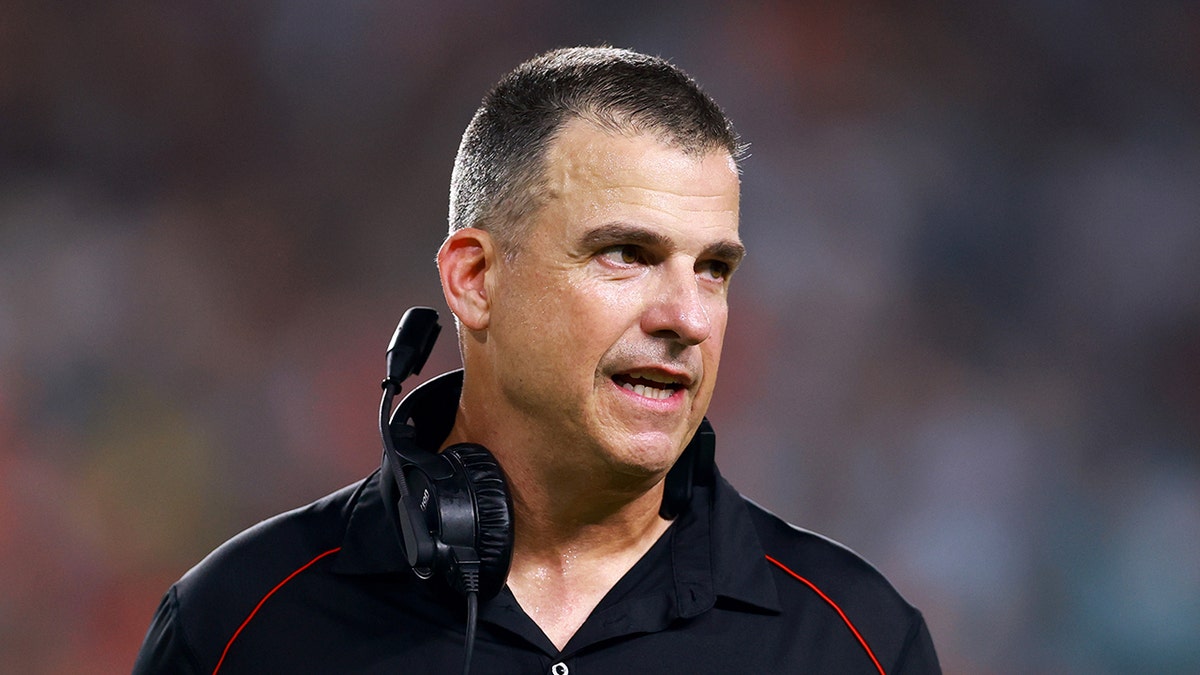 Mario Cristobal looks on field