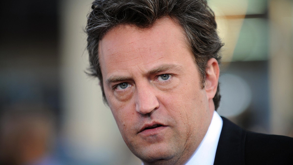 Close up of serious-looking Matthew Perry
