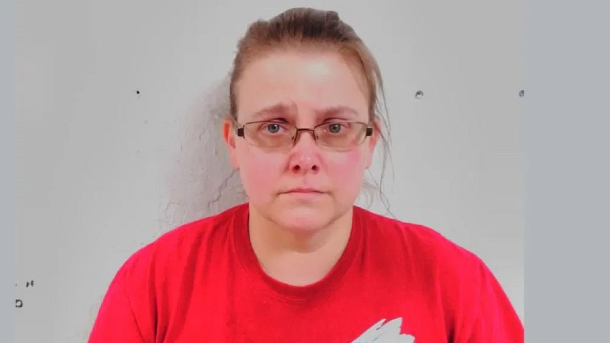 Amanda Myrene Fields Moffett, 43, wearing a red T-shirt, is seen in a mushot