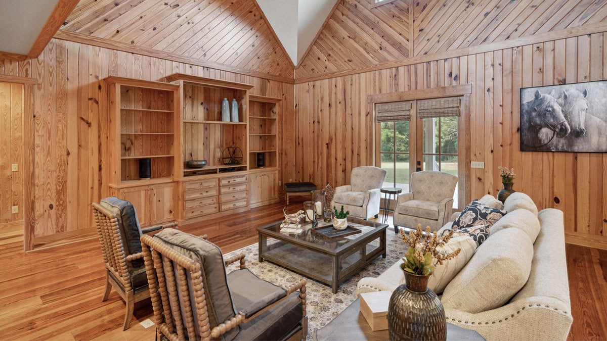 A pine tongue-and-grove paneled living room.